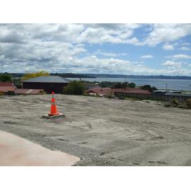 Photograph showing the empty site where the Lake House Hotel stood since 1872